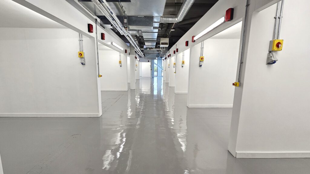 White row of training bays equipped with electrical sockets