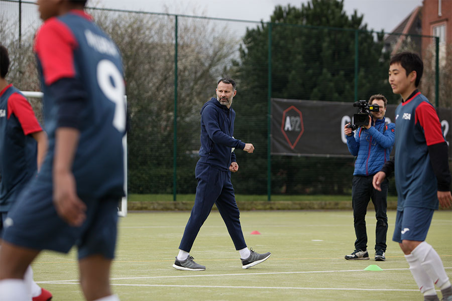 students playing football